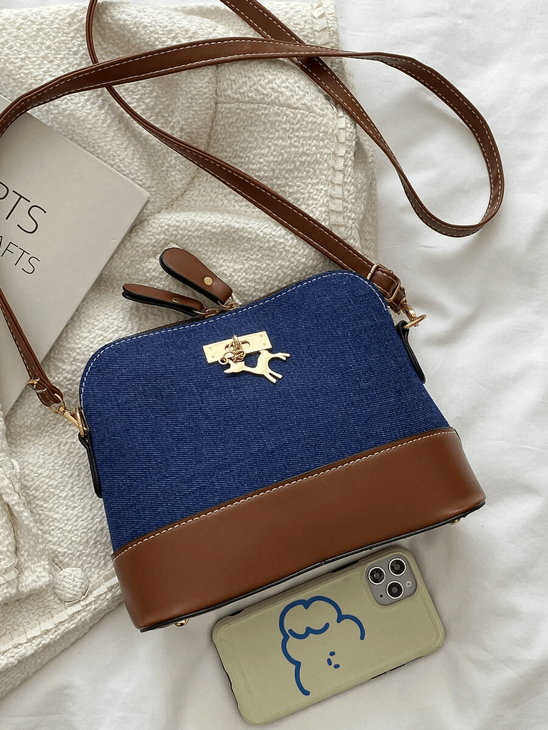 Sac dôme bicolore à détail en métal.2